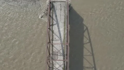 Flight along the old arch bridge. Old metal arch bridge. Stock Footage 138196835