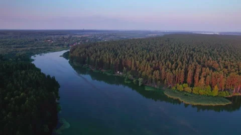 Flight along a river flowing through a forest Stock Footage 213069929