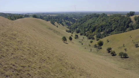 Flight along the slope of the hill Stock Footage 138711684