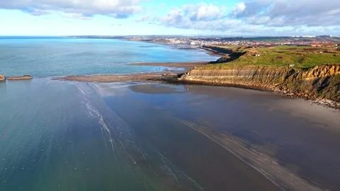 Flight along steep cliffs above a beach near Boulogne-sur-Mer Stock Footage 347177586