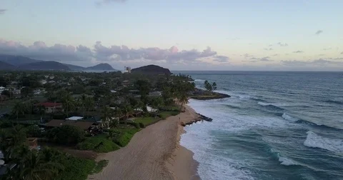 Flight along a sunset beach with ocean waves Video stock 72491954