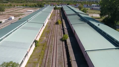 Flight along train tracks and roofs in Mannheim Vídeos de archivo 144820807