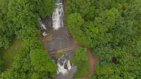 Flight along the waterfall Aerial View Flying Over Rushing Waterfall Stock Footage 77611061