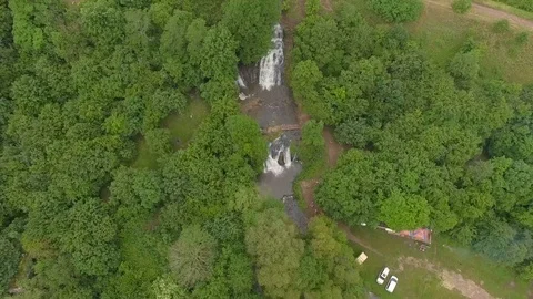 Flight along the waterfall Aerial View Flying Over Rushing Waterfall Stock Footage 77612817