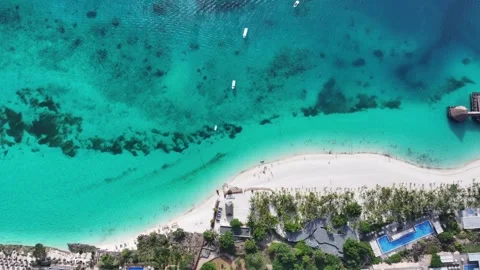  flight along white sand strand with people and turquoise water in Kendwa Beach Vídeos de archivo 289064522