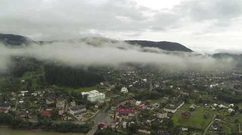 Flight among clouds over mountain village. Aerial   Stock Footage 43160429