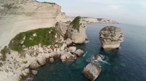 Flight and takeoff over Bonifacio bay area. Rocks and sea. Corsica, aerial view. 動画素材 47423172