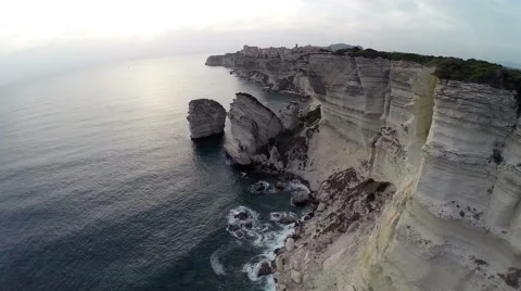 Flight and takeoff over Bonifacio bay area at sunset. Aerial panoramic view. Stock-Footage 47432459