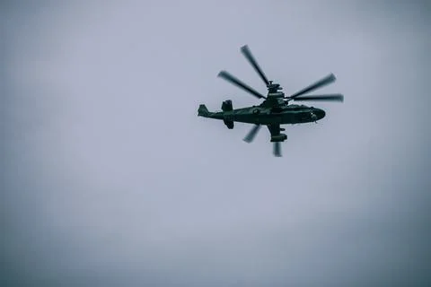 Flight of an army helicopter. Stock Photos