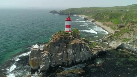 Flight around Basargin lighthouse cityscape Vladivostok nature Emotional footage Video stock 145313534