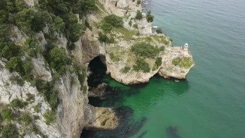 Flight around the cliff lighthouse Stock Footage 166199599