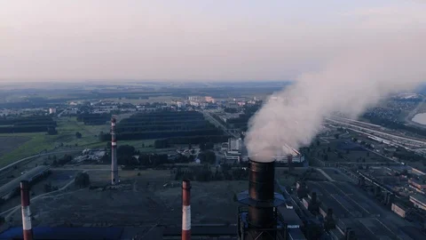 Flight around Smoking Chimney of Coal Plant at Dawn Stock Footage 112991499