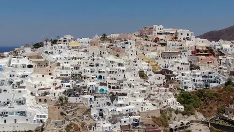 Flight around of Three Blue Domes church in Oia town on Santorini island, Greece Stock Footage 120637814