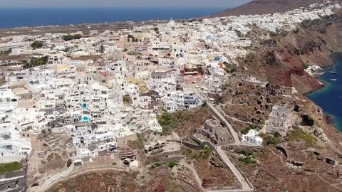 Flight around of Three Blue Domes church in Oia town on Santorini island, Greece Video stock 120638019