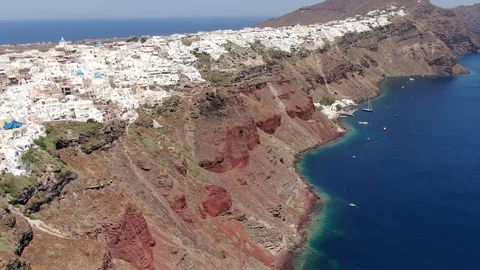 Flight around of Three Blue Domes church in Oia town on Santorini island, Greece Video stock 120638175