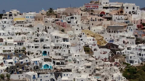 Flight around of Three Blue Domes church in Oia town on Santorini island, Greece Video stock 120641496