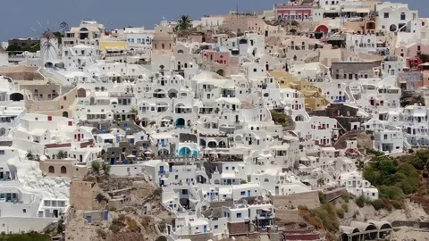 Flight around of Three Blue Domes church in Oia town on Santorini island, Greece Stock Footage 120738326