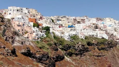 Flight around of Three Blue Domes church in Oia town on Santorini island, Greece Stock Footage 120874498