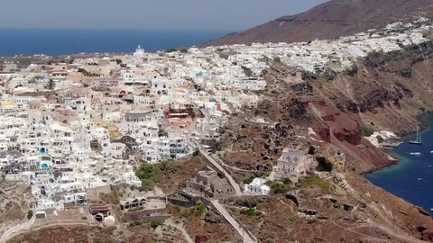 Flight around of Three Blue Domes church in Oia town on Santorini island, Greece Stock Footage 121261347