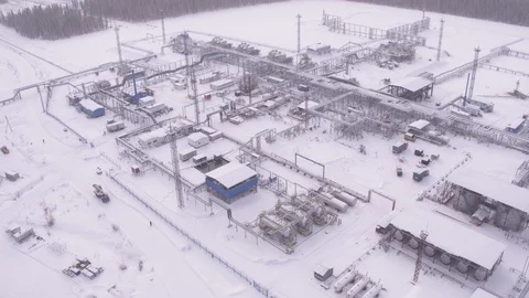 Flight around winter gas field Video stock 123710490