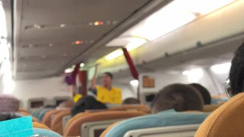 A flight attendant conducts a pre-flight briefing. Blur video. Stock Footage 319404913