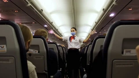 The flight attendant gives instructions of an emergency Stock Footage 169655585