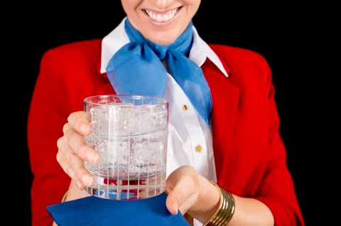 Flight attendant serving a drink Stock Photos