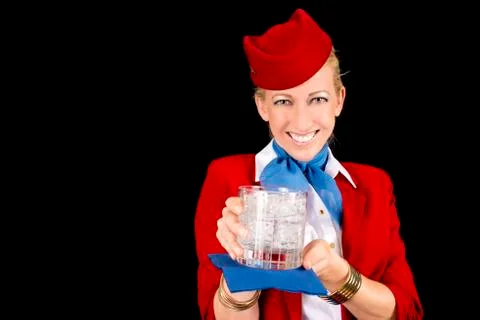 Flight attendant serving a drink Stock Photos