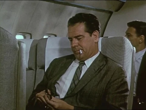 Flight attendants serve meal to passengers during the flight - 1959 Stock Footage 119111419