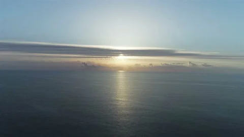 Flight back over the ocean at dawn Stock Footage 93972347
