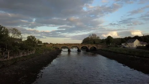 Flight backing away from a small bridge Stock Footage 108426671