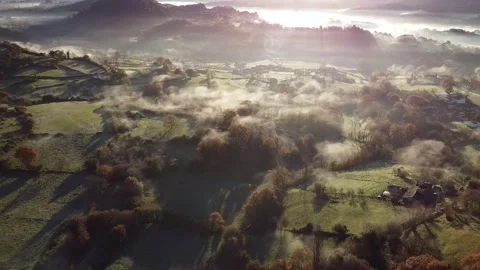 Flight backwards over foggy fields in the morning. Asturias. Spain Video stock 152814895