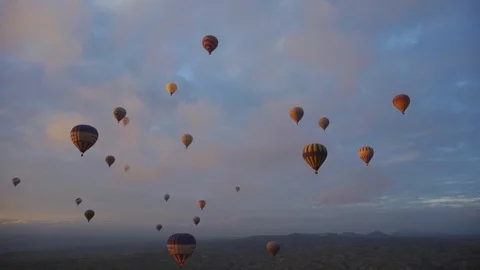 The flight of balloons at dawn over the valley Stock Footage 102462508