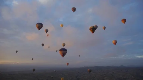 The flight of balloons at dawn over the valley Stock Footage 102462535