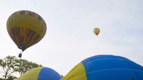 The flight of balloons at dawn over the valley 4K Stock Footage 112227384