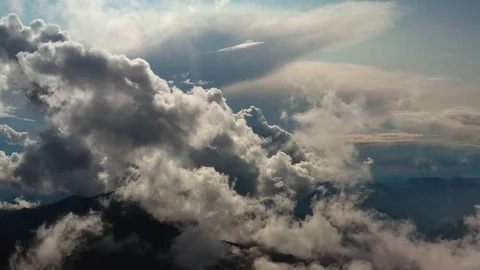 The flight in beautiful clouds on the sunny background Video stock 116057368