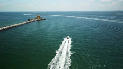 Flight behind a boat on the ocean Stock Footage 159059136