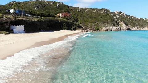 Flight between beach and crystal clear water Stock Footage 128841468