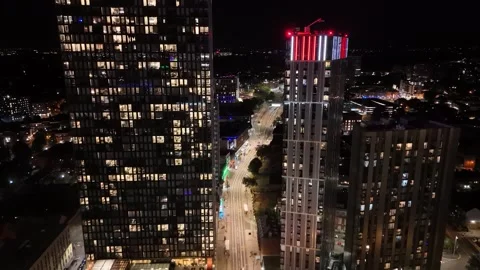 Flight between the buildings with a drone in Birmingham Stock Footage 253224101