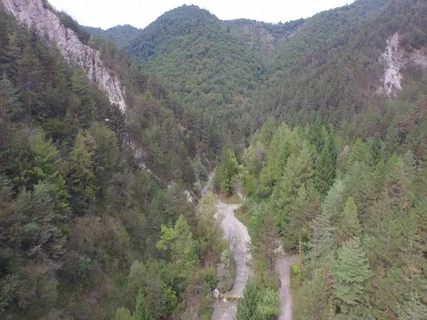 Flight between mountains on a cloudy day Stock Footage 72214735