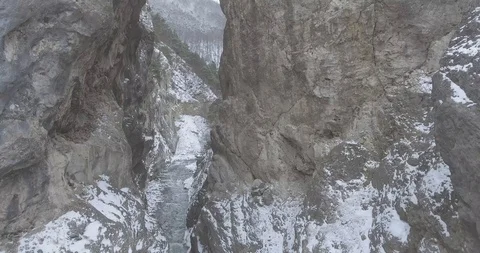 Flight between the rocks that the mountain river cut through Stock Footage 95573279