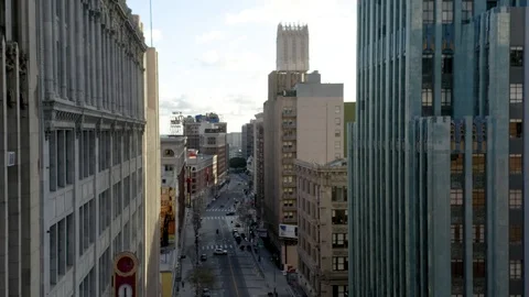 Flight in between skyscraper in Los Angeles  over broadway street during Stock Footage 126969255
