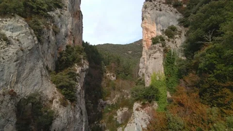 Flight between two high mountains. Drone flies into a crevice between two rocks Видео 171545397