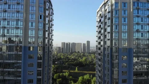 The flight between two modern high-rises in the background is an urban city Stock Footage 143614506