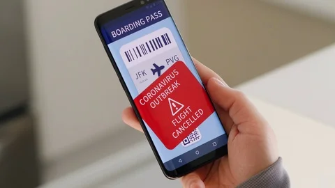 Flight Boarding Pass Cancelled due to Coronavirus Outbreak on Smartphone Stock Footage 127129587