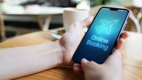 Flight booking application on mobile phone screen. Business and technology Фото