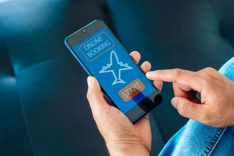 Flight booking application on mobile phone screen. Business and technology .. Fotos Stock