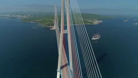 Flight cable-stayed Russian bridge Vladivostok epic cityscape Sailing ship float Stock Footage 145589856