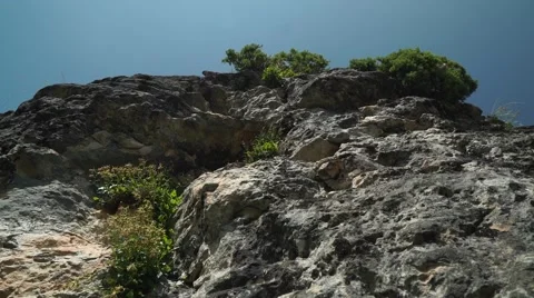 Flight of the Camera Along a Stone Against High Mountains and the Blue Sky Stock-Footage 66278310