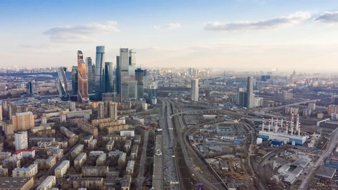 Flight of the camera over the high-rise buildings, traffic and lights of cars on Stock Footage 109370415